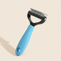 Blue 17-tooth dog grooming rake comb with black head and stainless-steel teeth